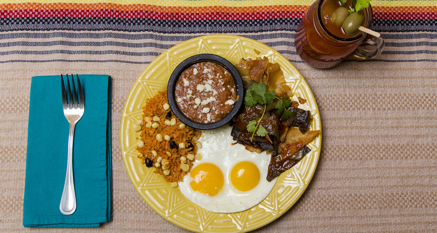 A breakfast dish and drink on a table