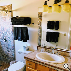 The Rammed-Earth House bathroom at Cat Mountain Lodge