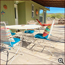 The Tiny House patio sitting area and mountain views at Cat Mountain Roadside Inn